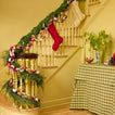 Stairway with garland and stockings.
