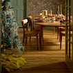 Simple linen tree skirt under tree in a dining room