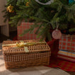 Red and terracotta gingham tree skirt under tree with presents