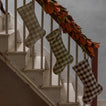 Gingham stockings hung on staircase