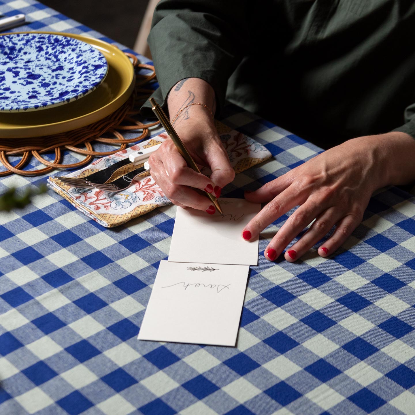 Sprig placecards being written on 