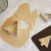 Christmas tree cookie cutter with dough 