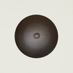 Overhead view of spun iron wok lid