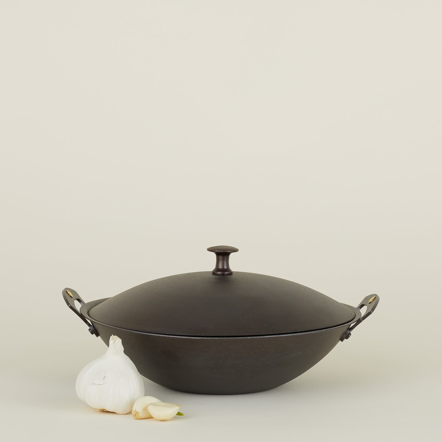 Spun iron wok with garlic