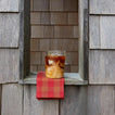 Iced coffee in Clear Essential Glass with Essential Gingham Napkin in window.
