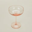 Three-quarter angle of ribbed blush coupe glass.