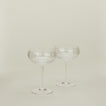 Set of two ribbed clear coupe glasses.