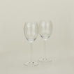 Set of two ribbed clear wine glasses.