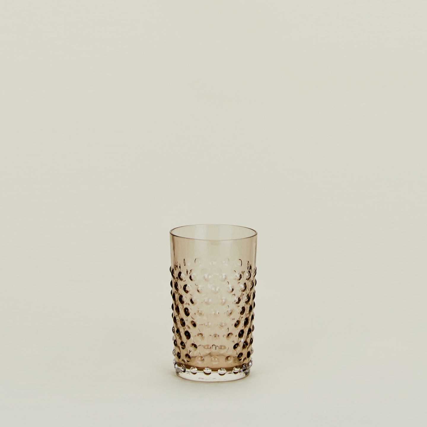 Textured grey glass tumbler.