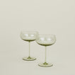 Set of two ribbed olive coupe glasses.