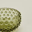 Close up of glass hobnail olive tapas bowl.