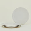Group of four Atelier Dinner Plates.
