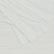 Close up view of Cahaya pleated tablecloth in ivory