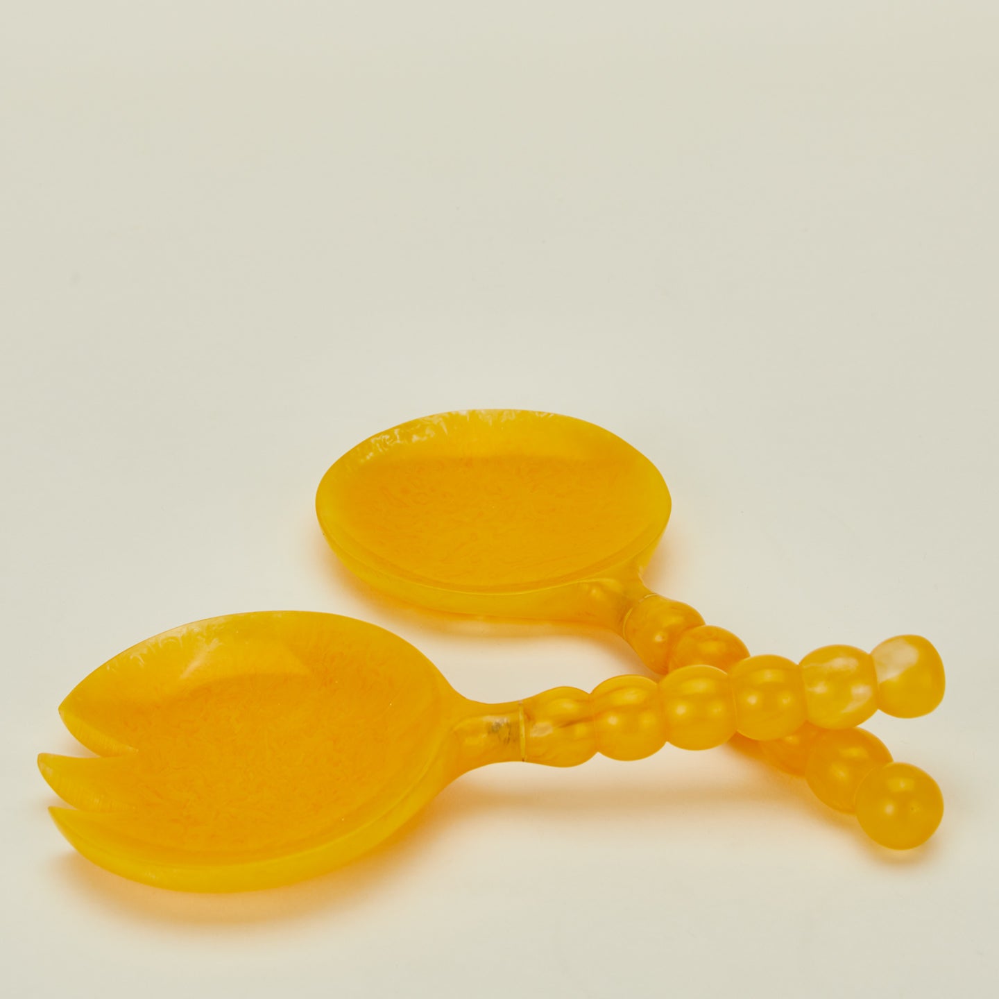 Close up view of Lemon Yellow Salad Servers