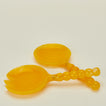 Close up view of Lemon Yellow Salad Servers