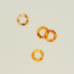 Overhead view of toroiseshell napkin rings, set of 4