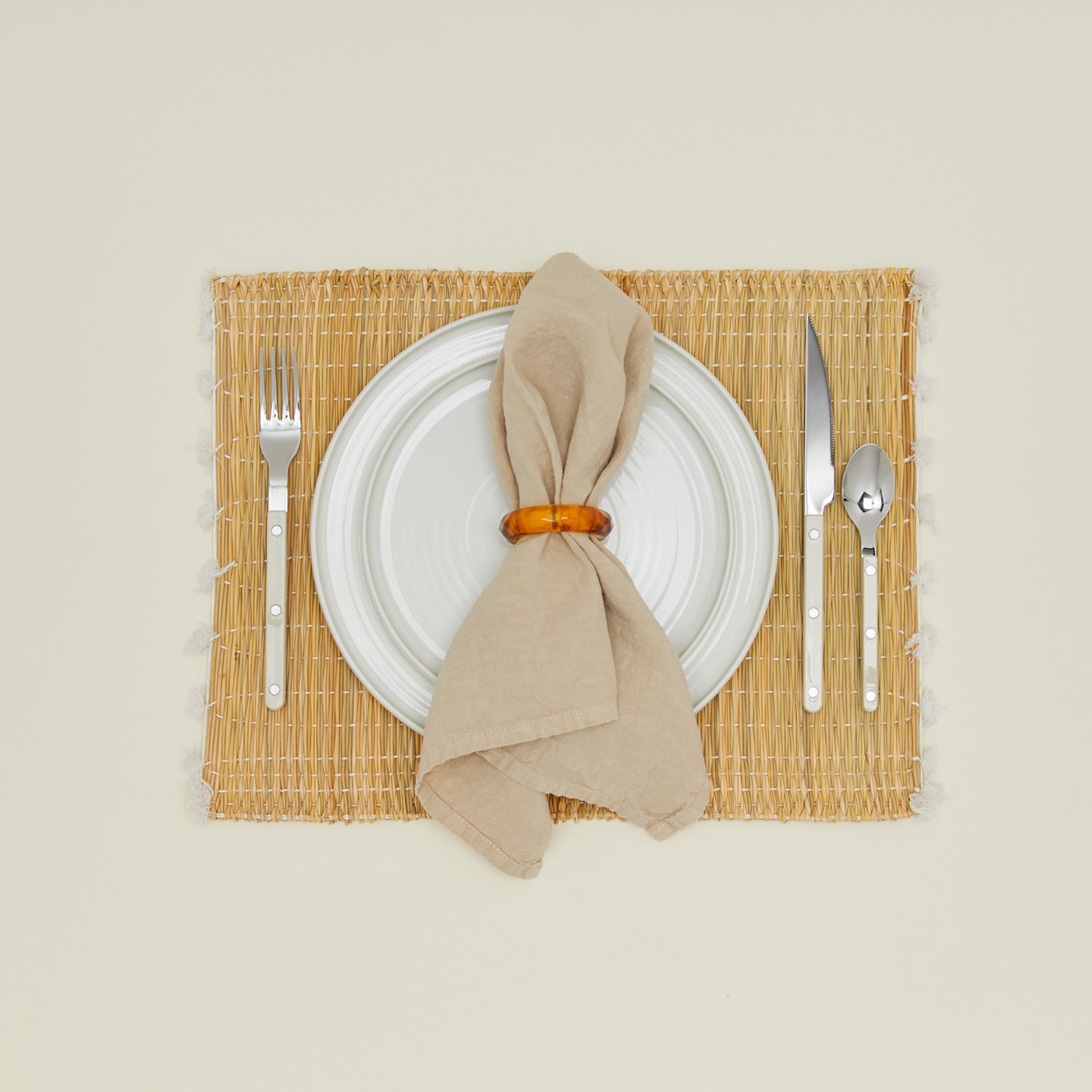 Tortoiseshell napkin ring with napkin and placesetting