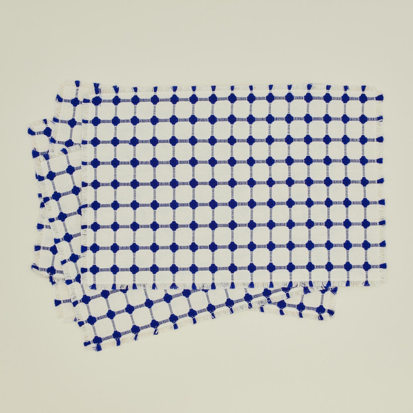 Dove and Donkey wicker fringed placemat in cobalt