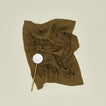 Linen tea towel with olives with slotted flat spoon.