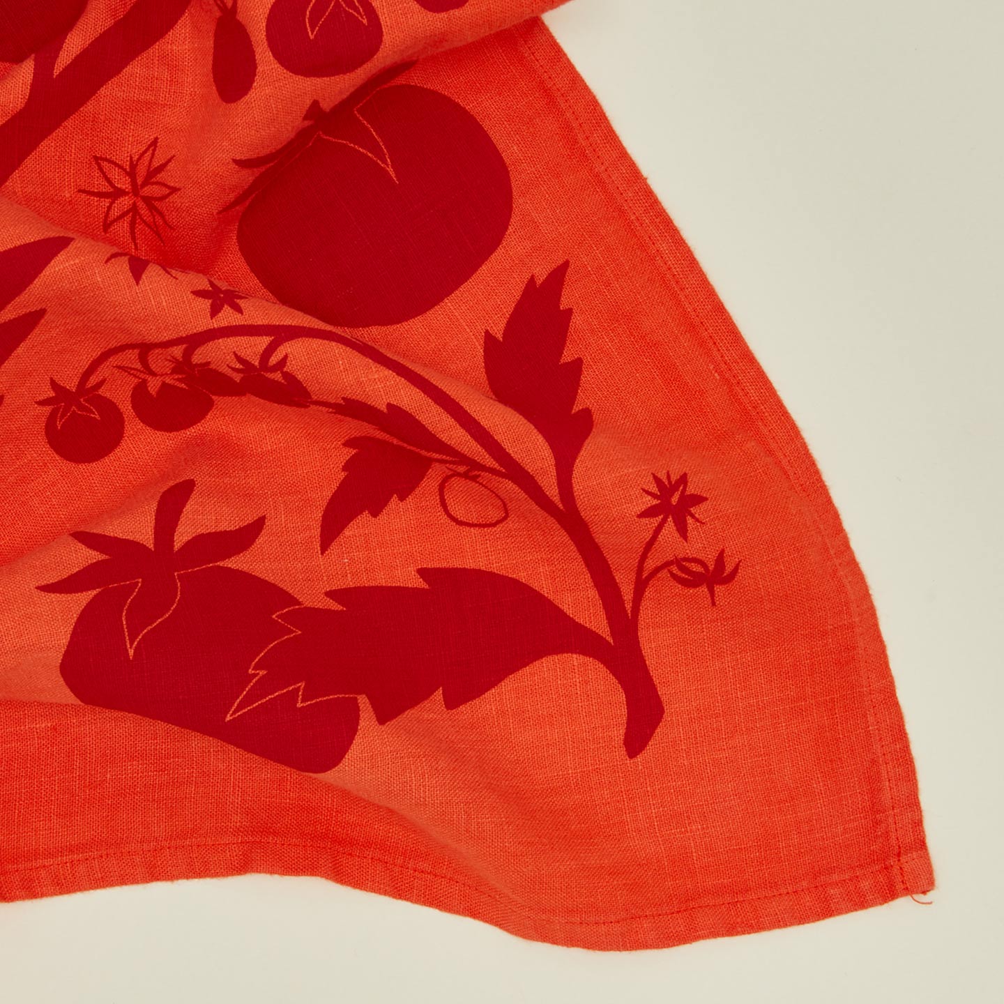 Close up view of tomato linen tea towel
