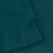 Close up view of essential cotton placemat in peacock
