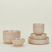 Set of blush pink Essential dinnerware including Large Bowls, Low Bowls, Salad Plates and Dinner Plates.