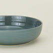 Close up view of essential dinnerware low bowl in peacock