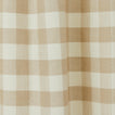 Close up view of gingham shower curtain in ivory/flax
