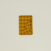 Folded Essential Gingham tablecloth in mustard/bronze
