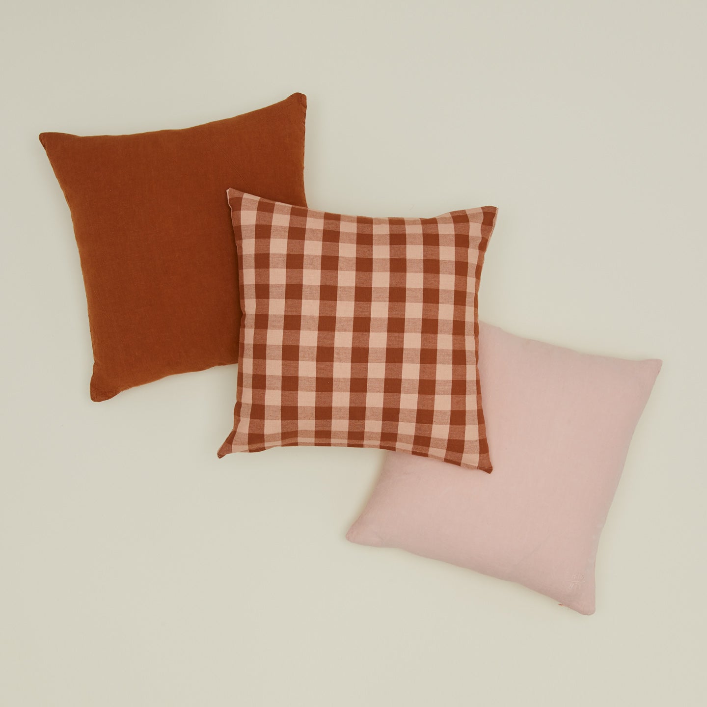 Essential gingham pillow and simple linen pillows in blush and terracotta