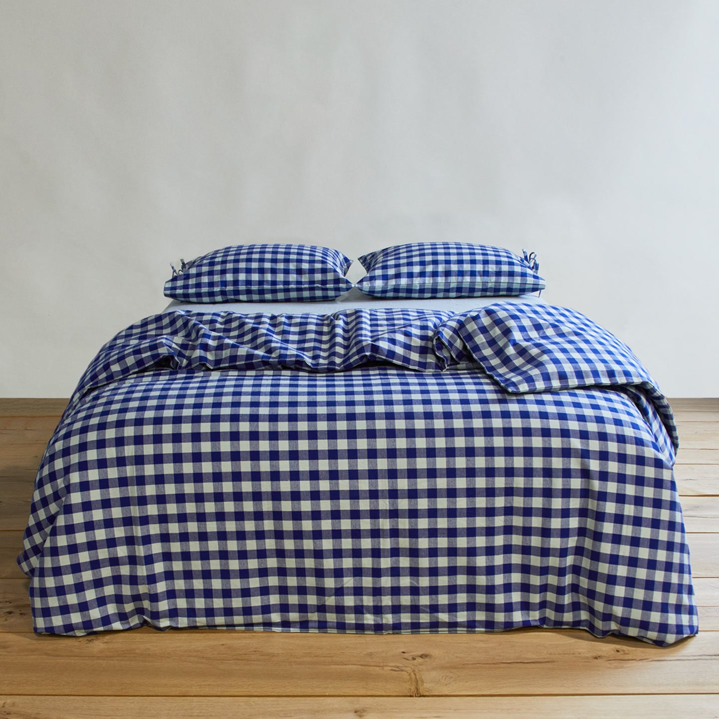 Essential Gingham Pillowcases, Set of 2 - Sky/Blue on bed with matching duvet