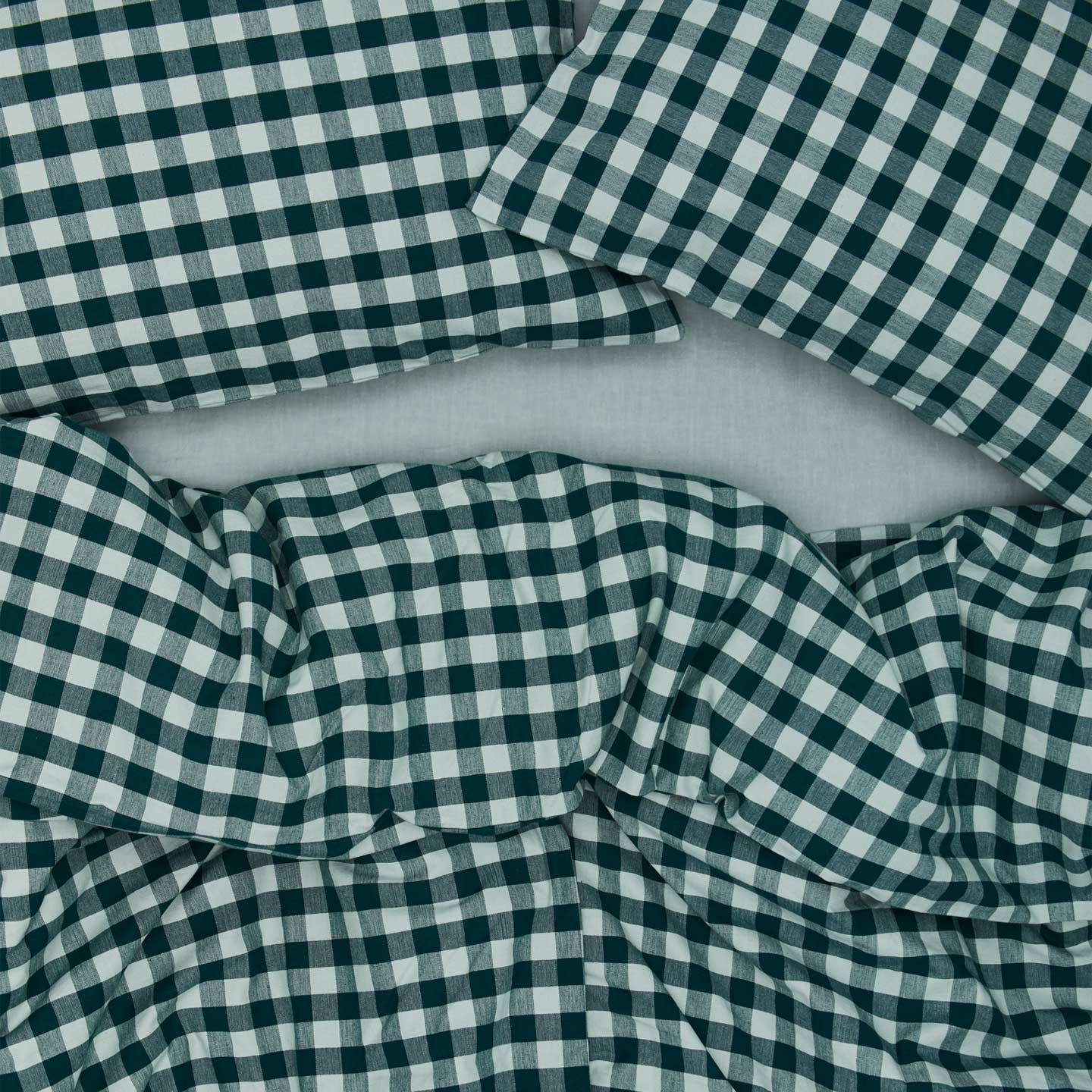 Essential Gingham Duvet - Sky/Peacock on bed with matching pillow cases