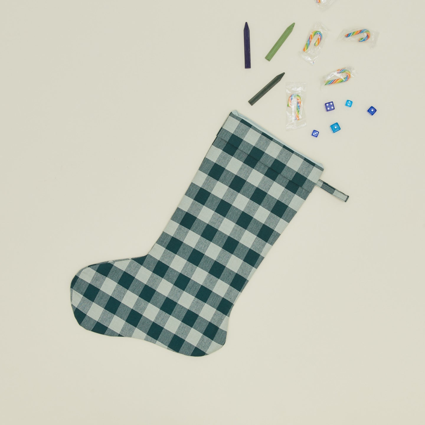 Essential Gingham Stocking - Sky/Peacock with crayons candy canes and dice