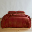 Essential Gingham Pillowcases, Set of 2 - Terracotta/Red on bed with matching duvet