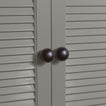 Large black essential sphere knobs on louvered doors