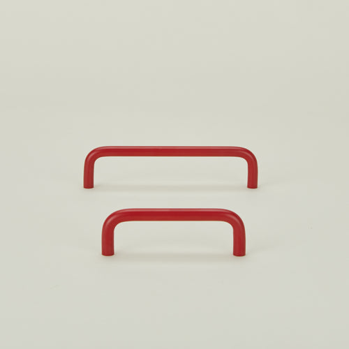 Large and small essential drawer pulls in red