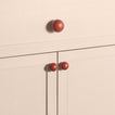 Large and small terracotta essential sphere knobs on drawers and cabinets