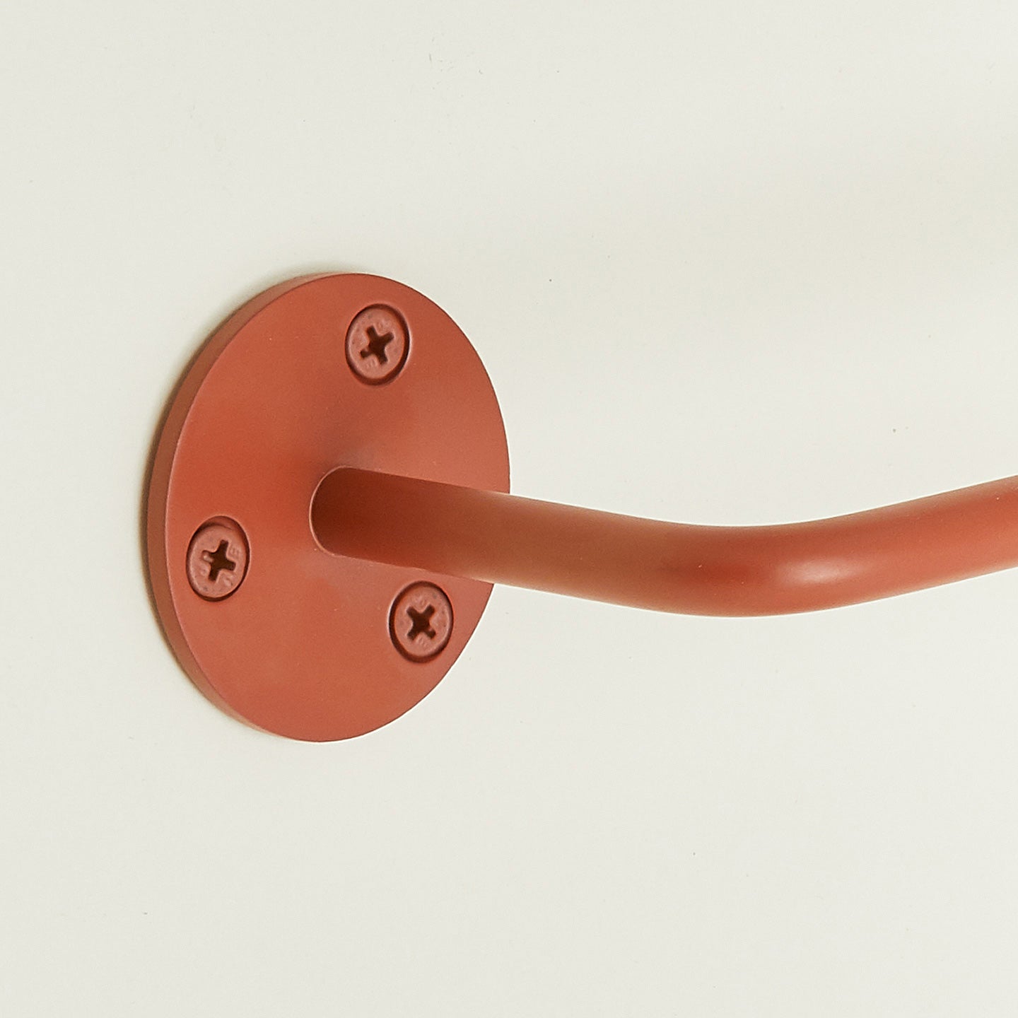 Close up of toilet paper holder in Terracotta.