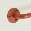 Close up of towel bar in Terracotta.
