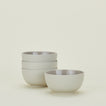Four light grey Essential Large Bowls.