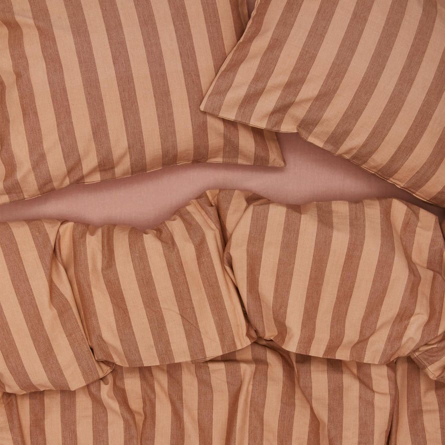 Essential Stripe Pillowcases, Set of 2 - Blush/Terracotta on bed with matching duvet