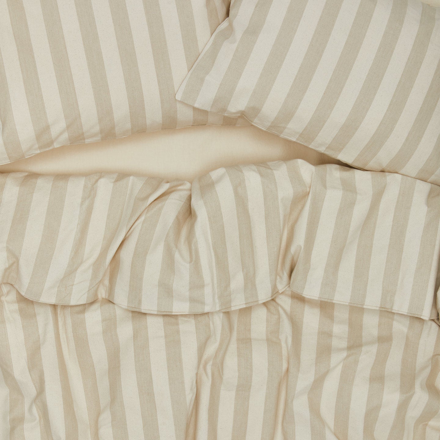Essential Stripe Pillowcases, Set of 2 - Ivory/Flax on bed with matching duvet