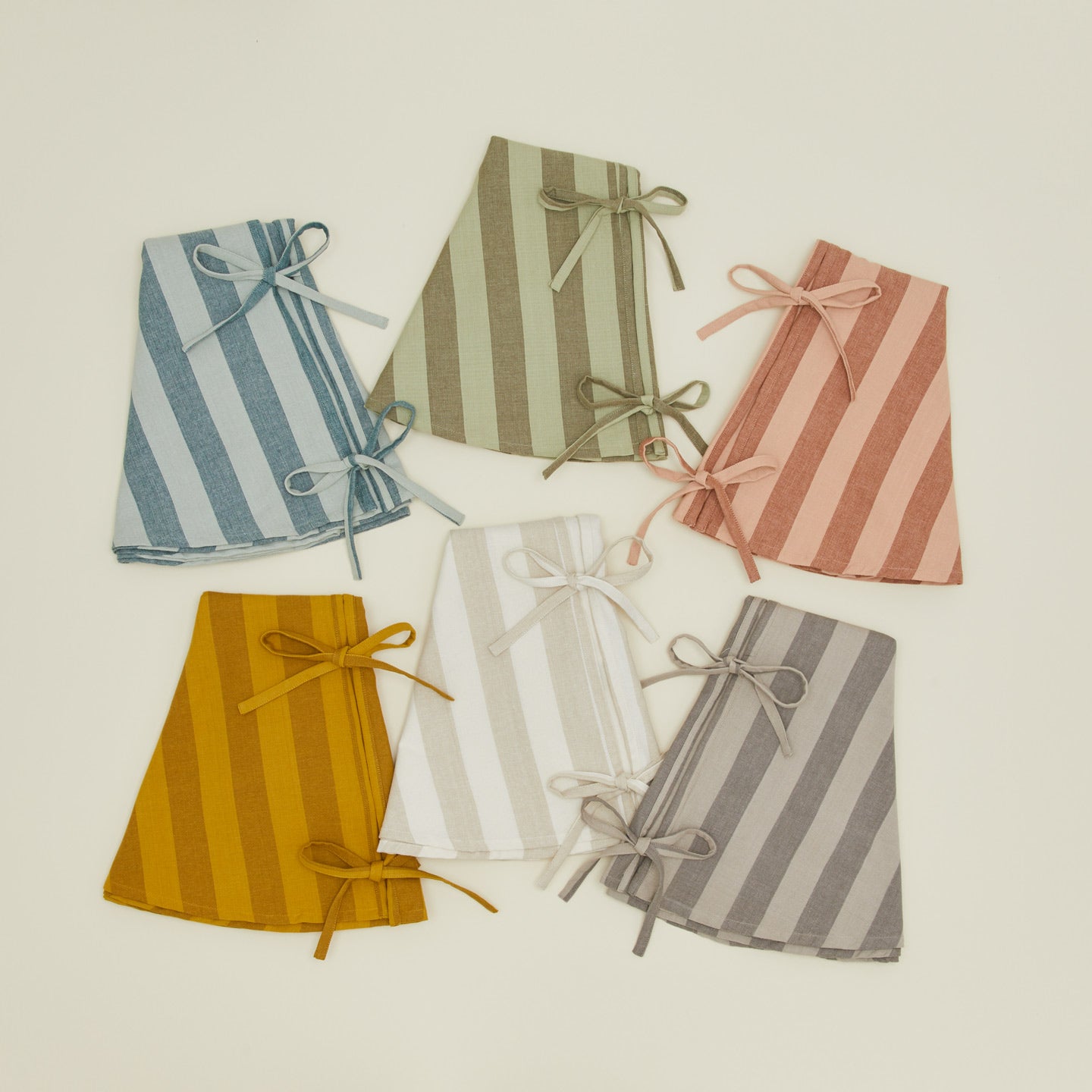 Essential striped tree skirts in various colors