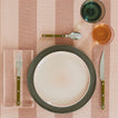 Placesetting on Essential Striped Tablecloth in Blush and Terracotta.