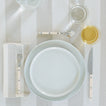 Placesetting on Essential Striped Tablecloth in Ivory and Flax.