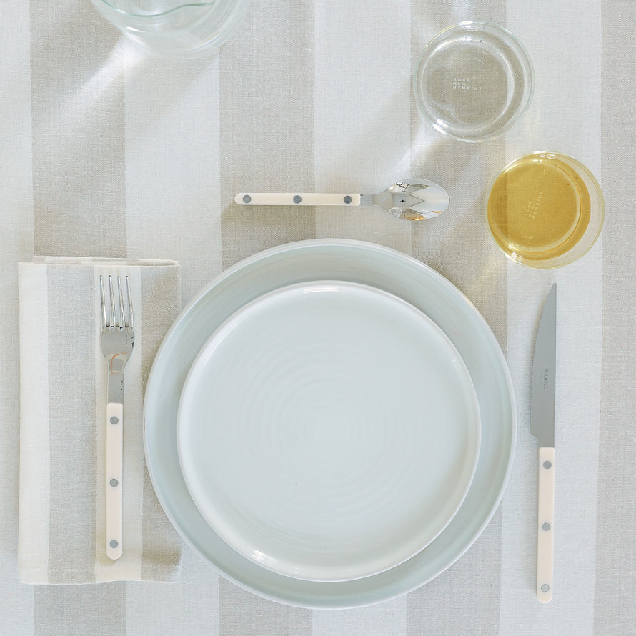 Placesetting on Essential Striped Tablecloth in Ivory and Flax.