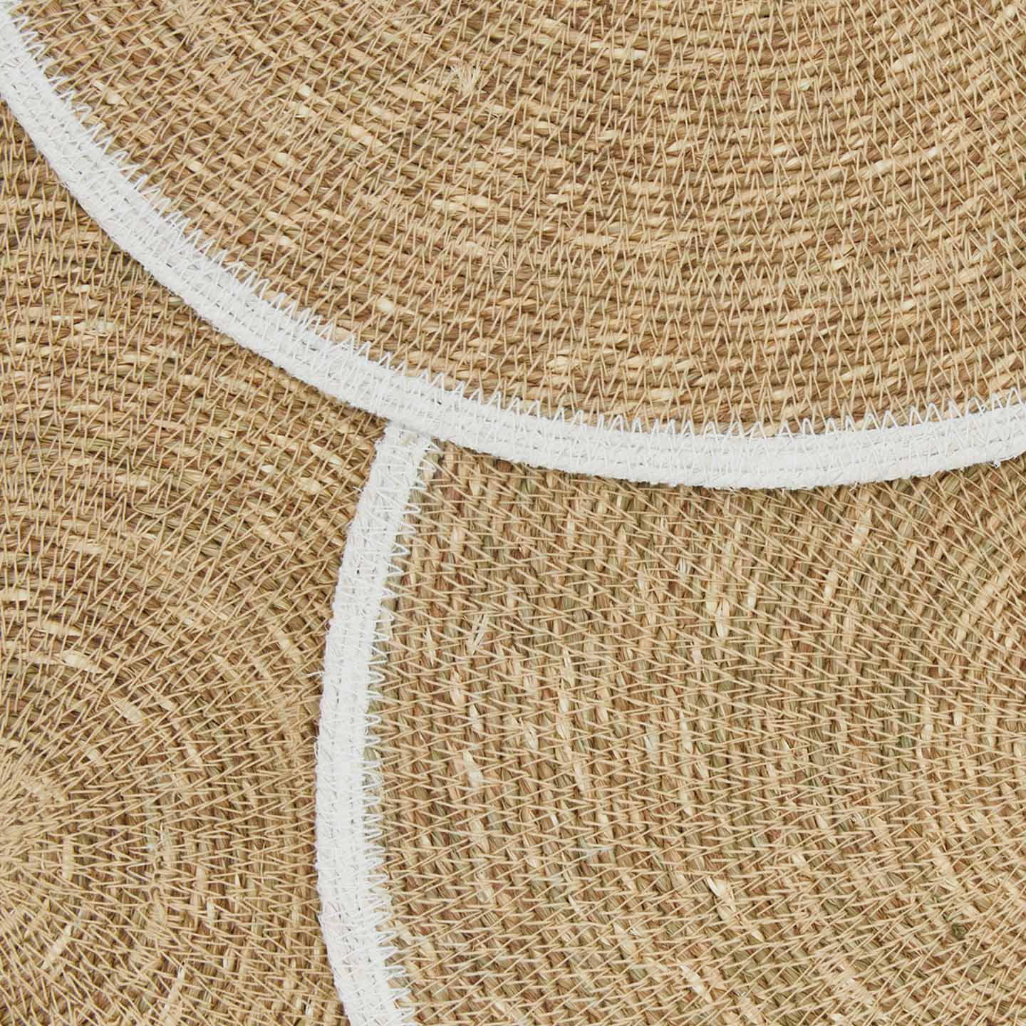 Close up view of essential woven placemat in white