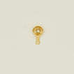 Brass egg separator on a beige background