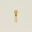 Brass ice cream scoop on a beige background