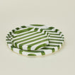 Detailed view of Fodory olive striped plates